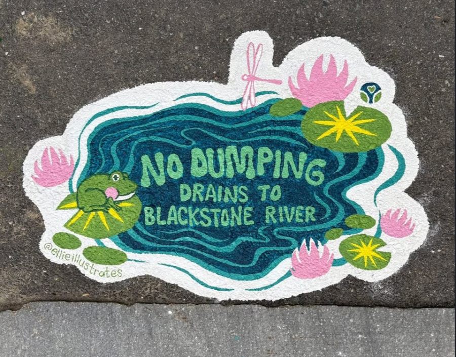 Bright mural of a green frog lounging on a lily pad in a cartoon-style blue pond surrounded by pink lotus flowers. Text reads “No Dumping – Drains to Blackstone River.”