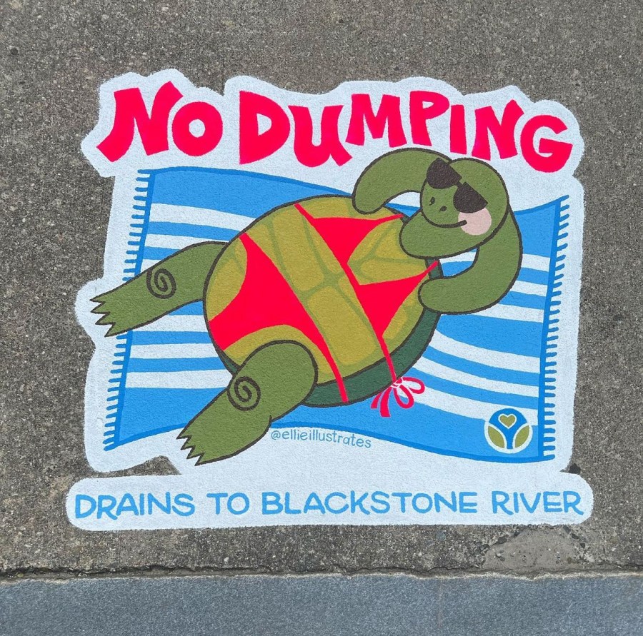 Sidewalk mural of a cartoon turtle relaxing on a striped beach towel in a red swimsuit and sunglasses, with the bold message “No Dumping – Drains to Blackstone River.”